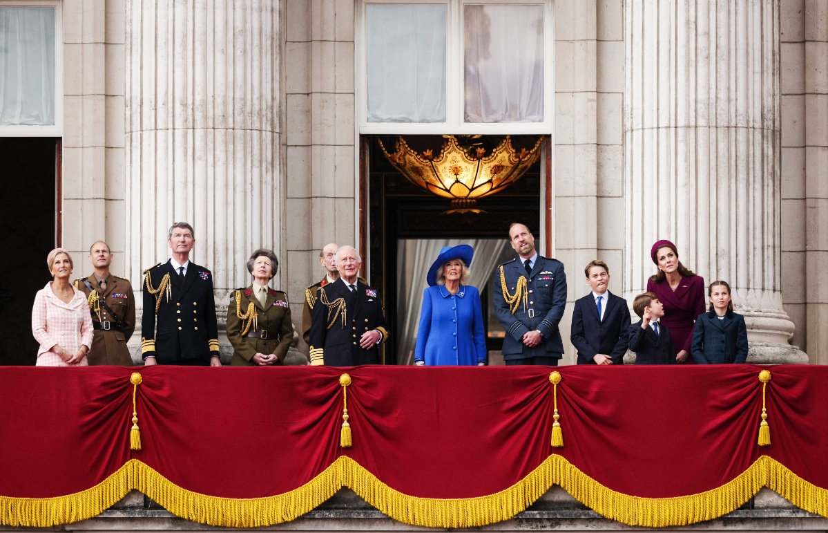 (From L to R) Britain's Sophie, Duchess of Edinburgh, Britain's Prince Edward, Duke of Edinburgh, Vice Admiral Timothy Laurence, Britain's Princess Anne, Princess Royal, Britain's Prince Edward, Duke of Kent, Britain's King Charles III, Britain's Queen Camilla, Britain's Prince William, Prince of Wales, Britain's Prince George of Wales, Britain's Prince Louis of Wales, Britain's Catherine, Princess of Wales and Britain's Princess Charlotte of Wales watch the Red Arrows flypast from Buckingham Palace balcony.