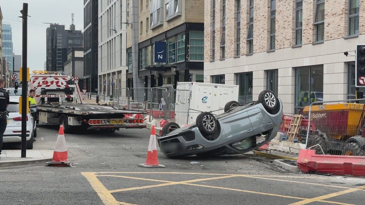 Car left on roof in Glasgow city centre after two-car collision at Bath Street and Pitt Street junction