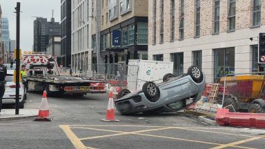 Car left on roof in Glasgow city centre after two-car collision at Bath Street and Pitt Street junction