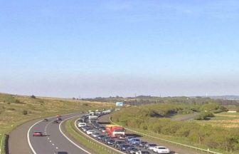 Drivers warned of hour long delays after crash on M77