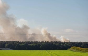 Dozens of firefighters tackling Forres wildfire as locals urged to close windows