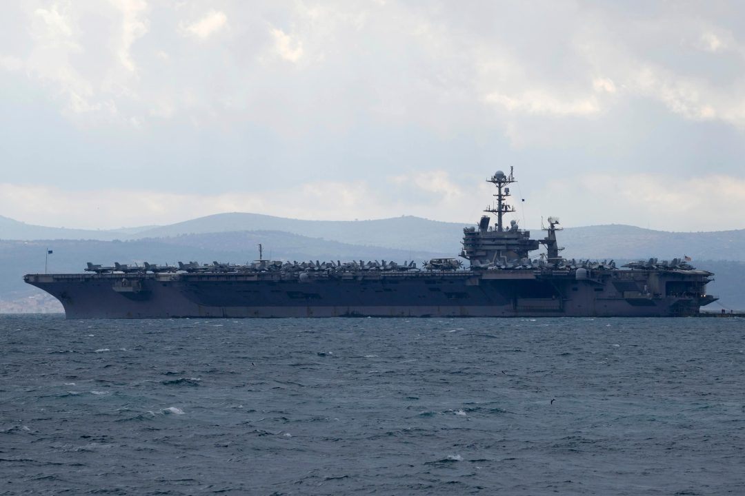 Fighter jet landing on US aircraft carrier goes overboard