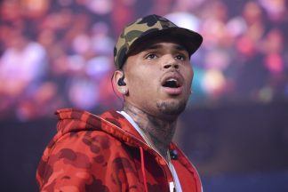 Singer Chris Brown to appear in court charged with grievous bodily harm