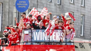 Scottish Cup winners Aberdeen parade trophy through city on open-top bus