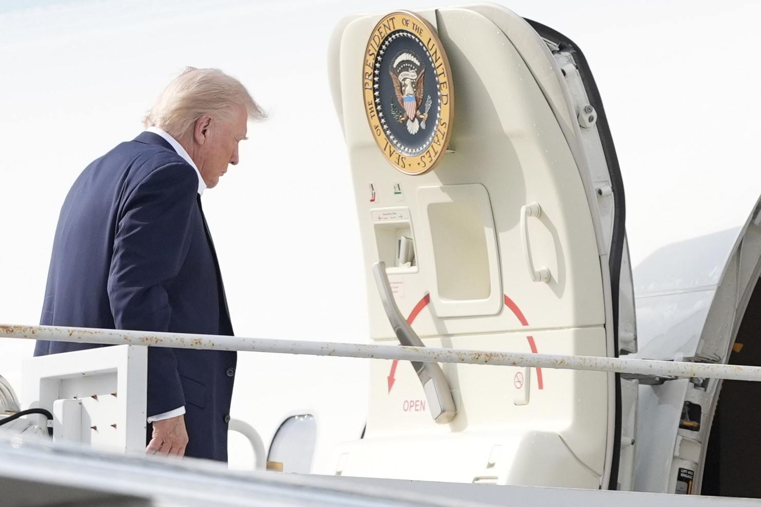 President Donald Trump boards Air Force One at Palm Beach International Airport on Sunday (Manuel Balce Ceneta/AP)