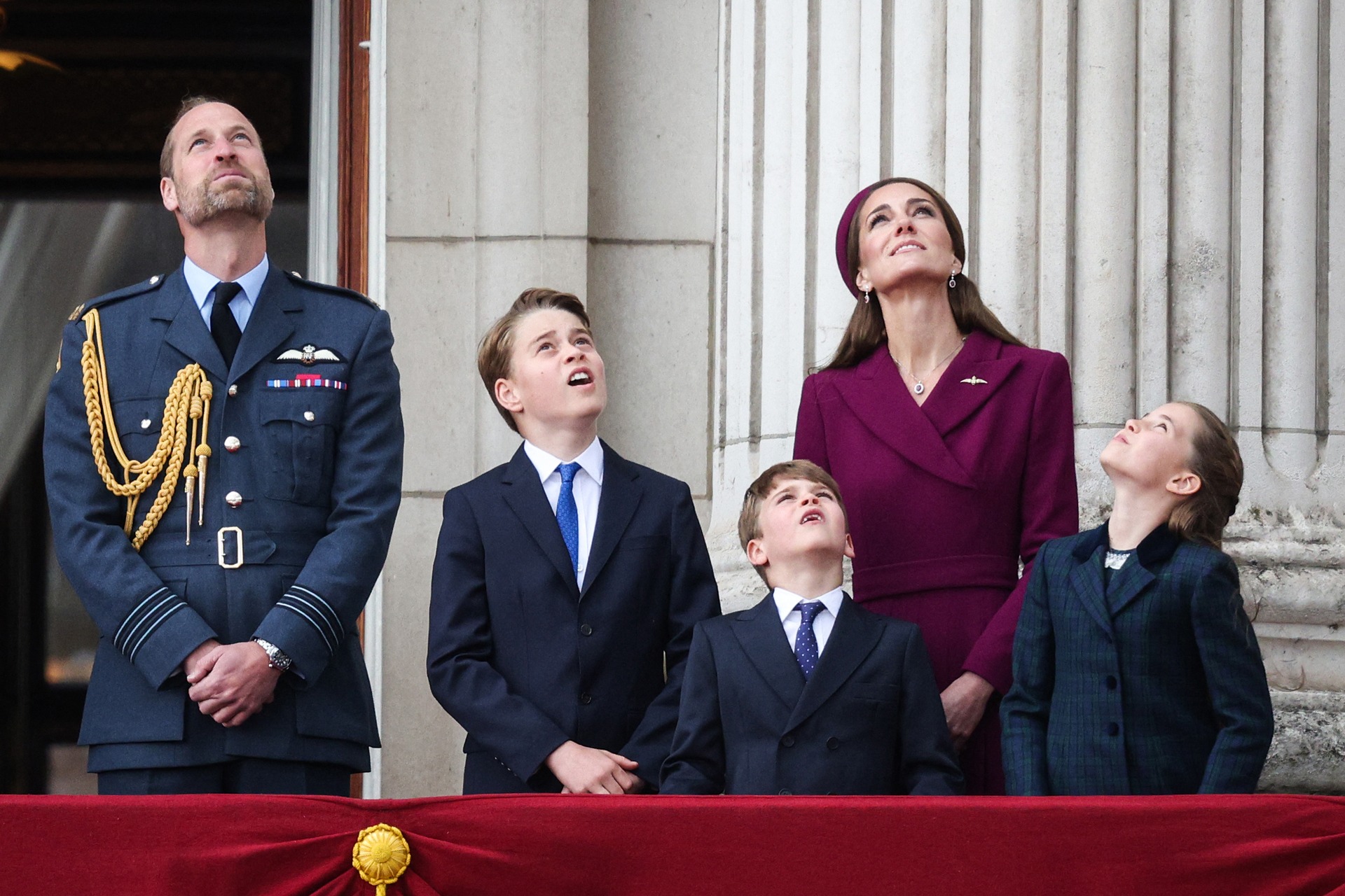 Britain's Prince William, Prince of Wales, Britain's Prince George of Wales, Britain's Prince Louis of Wales, Britain's Catherine, Princess of Wales and Britain's Princess Charlotte of Wales watch the Red Arrows flypast from Buckingham Palace balcony.
