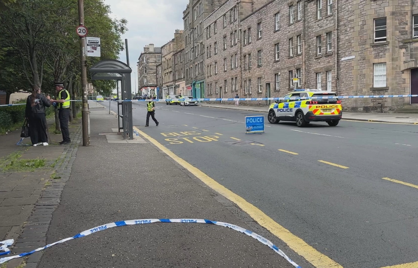 A baby has been taken to hospital and a man arrested after armed police sealed off roads in Edinburgh.