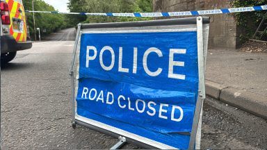 Road closed after body found reopens following investigation into death