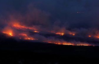 Roads closed as crews battle wildfire for third day in the Highlands