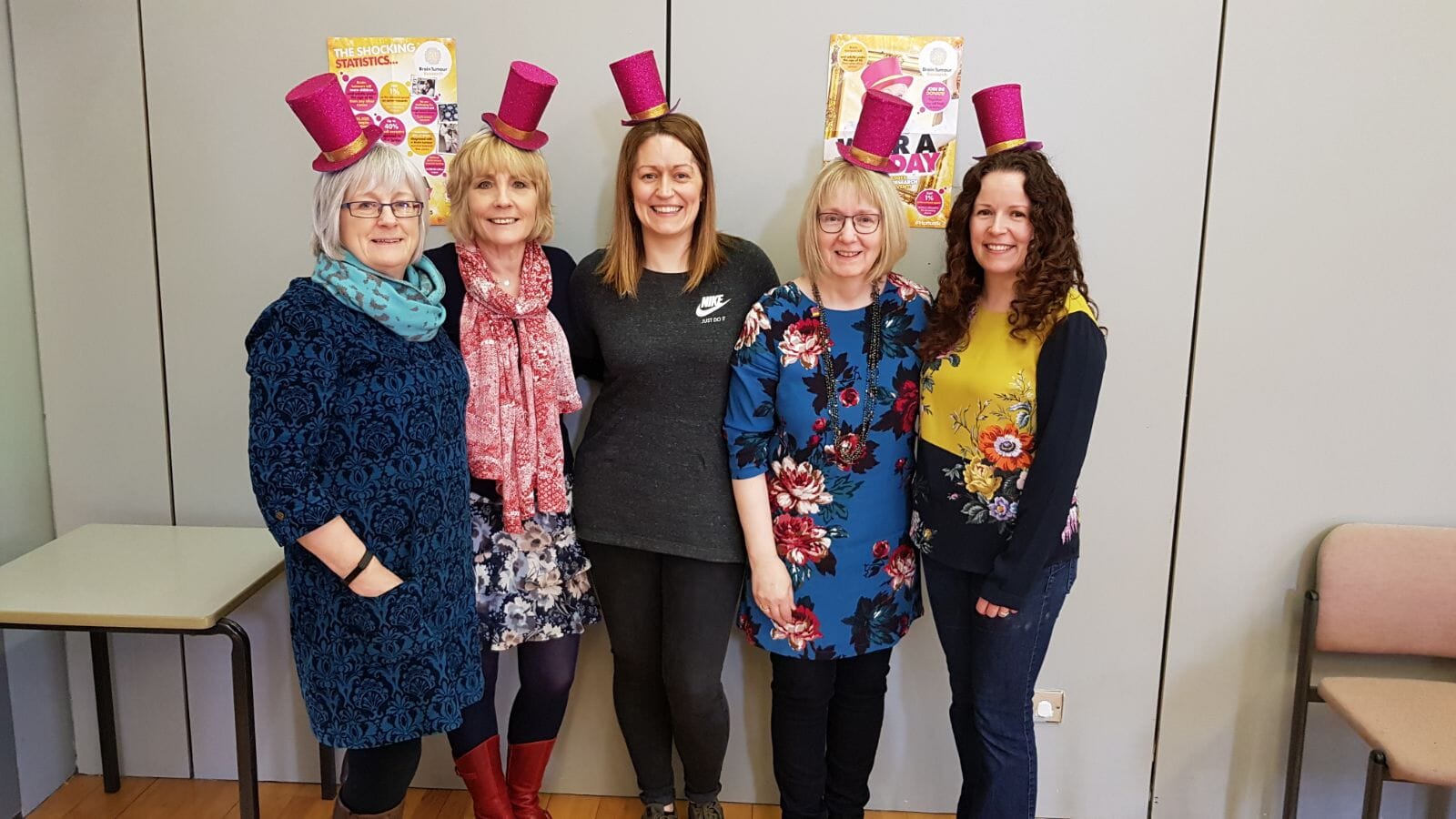 Beatrice Wishart, second right, with her daughters Louise Fraser, centre, and Clare Inkster, right, wearing hats in support of the charity (Brain Tumour Research/PA).