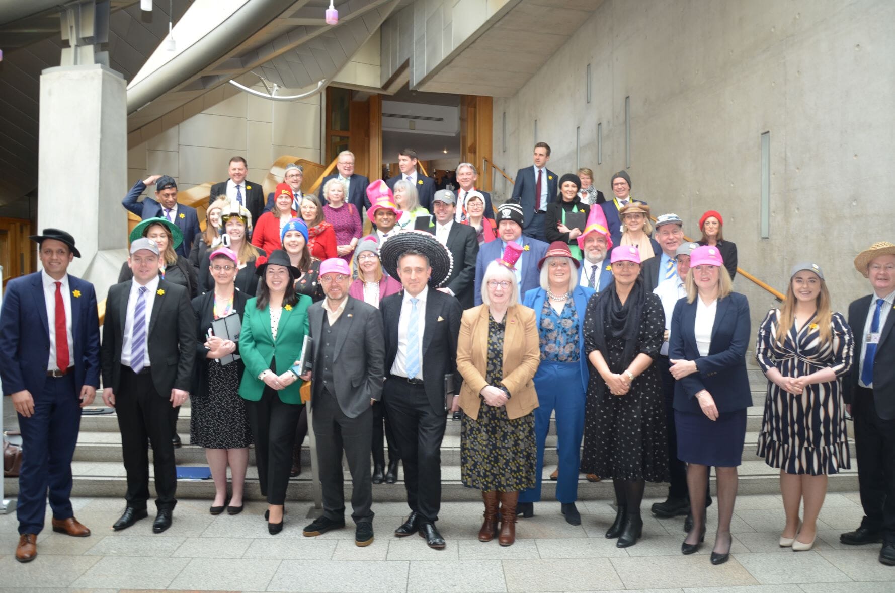 Beatrice Wishart and other MSPs supporting Wear A Hat Day at Holyrood in aid of Brain Tumour Research (Brain Tumour Research/PA).