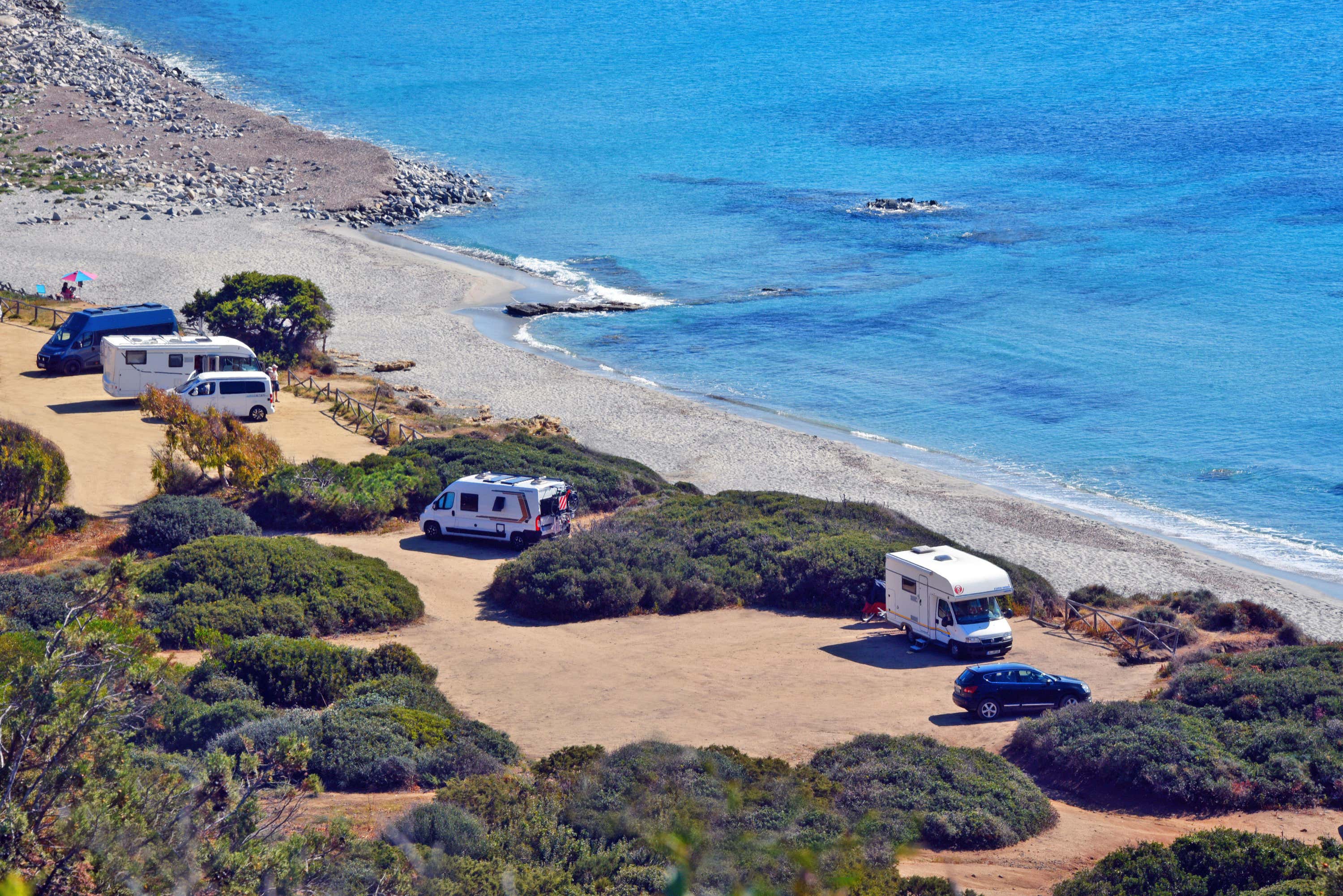 Motorhomes by the sea in Italy (Alamy/PA).