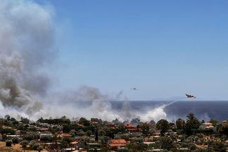 Communities evacuated amid wildfire near Athens as heatwave hits Greece