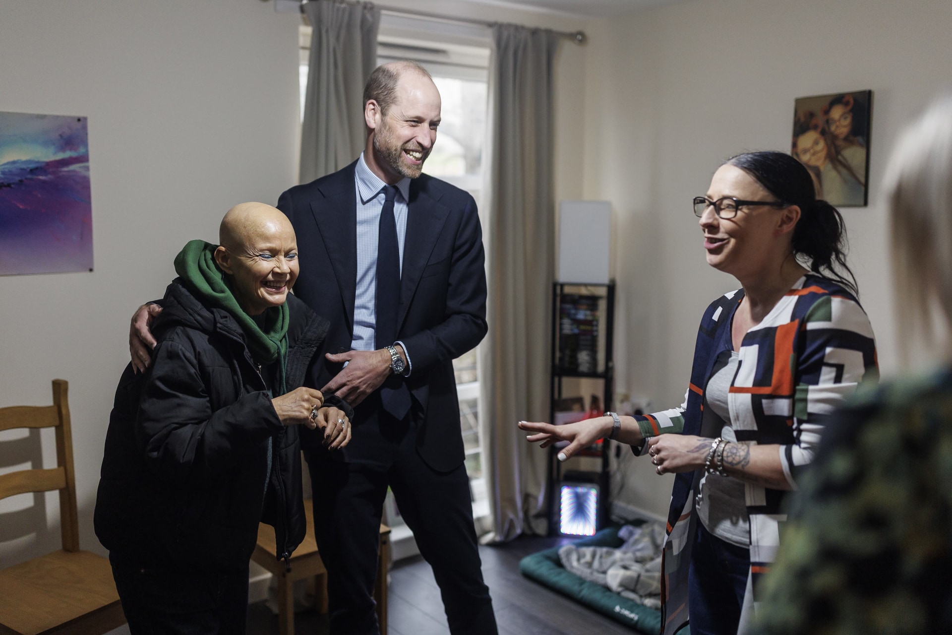 The Prince of Wales with Homewards advocate Gail Porter, as they met with a resident who moved into one of 31 newly furnished Homewards homes in Aberdeen (Derek Ironside/Daily Mail/PA).