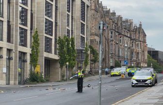 Baby taken to hospital as man arrested after armed police seal off Edinburgh roads