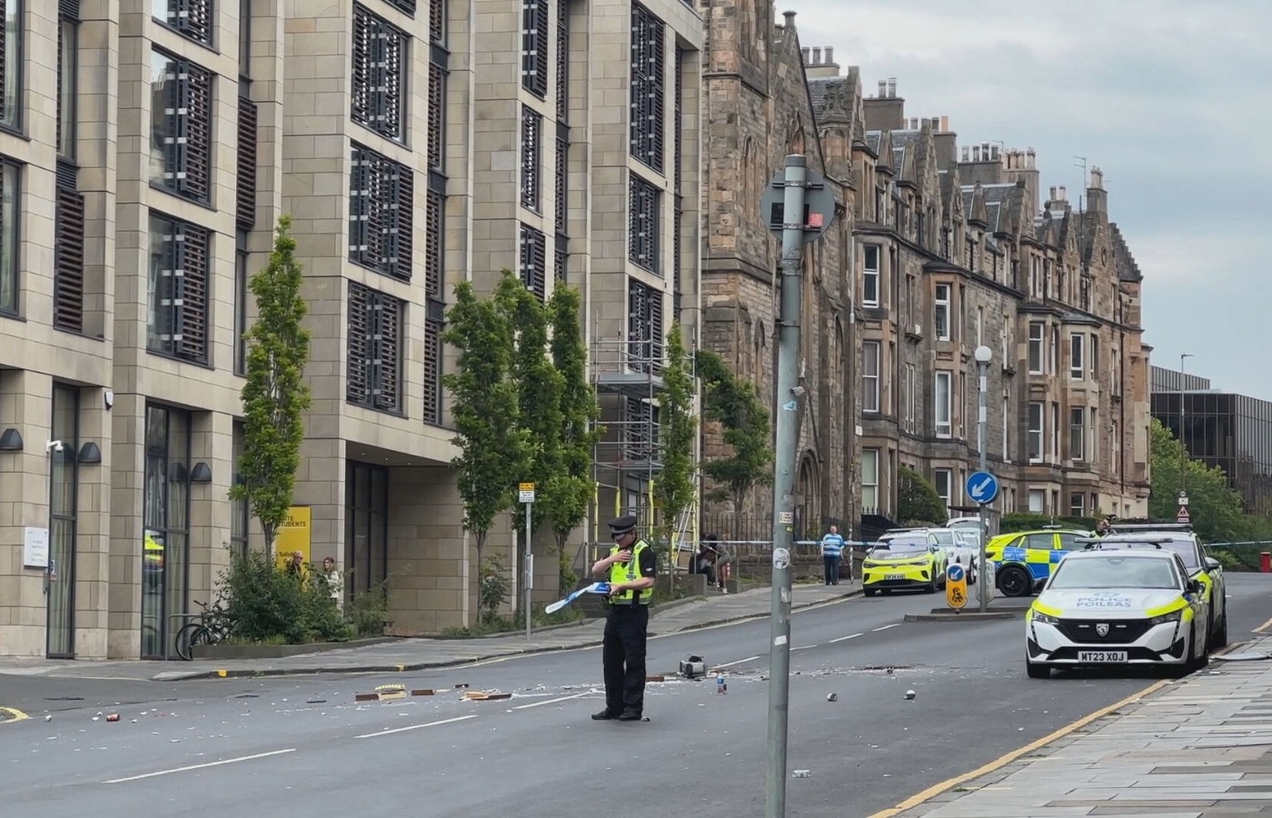 A baby has been taken to hospital and a man arrested after armed police sealed off roads in Edinburgh.