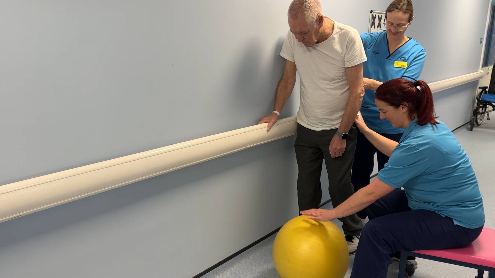 Neil Smith being supported by the physiotherapy team at Inverclyde Royal.