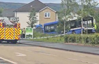 Driver and passenger in hospital after bus mounts pavement and crashes in Bishopton