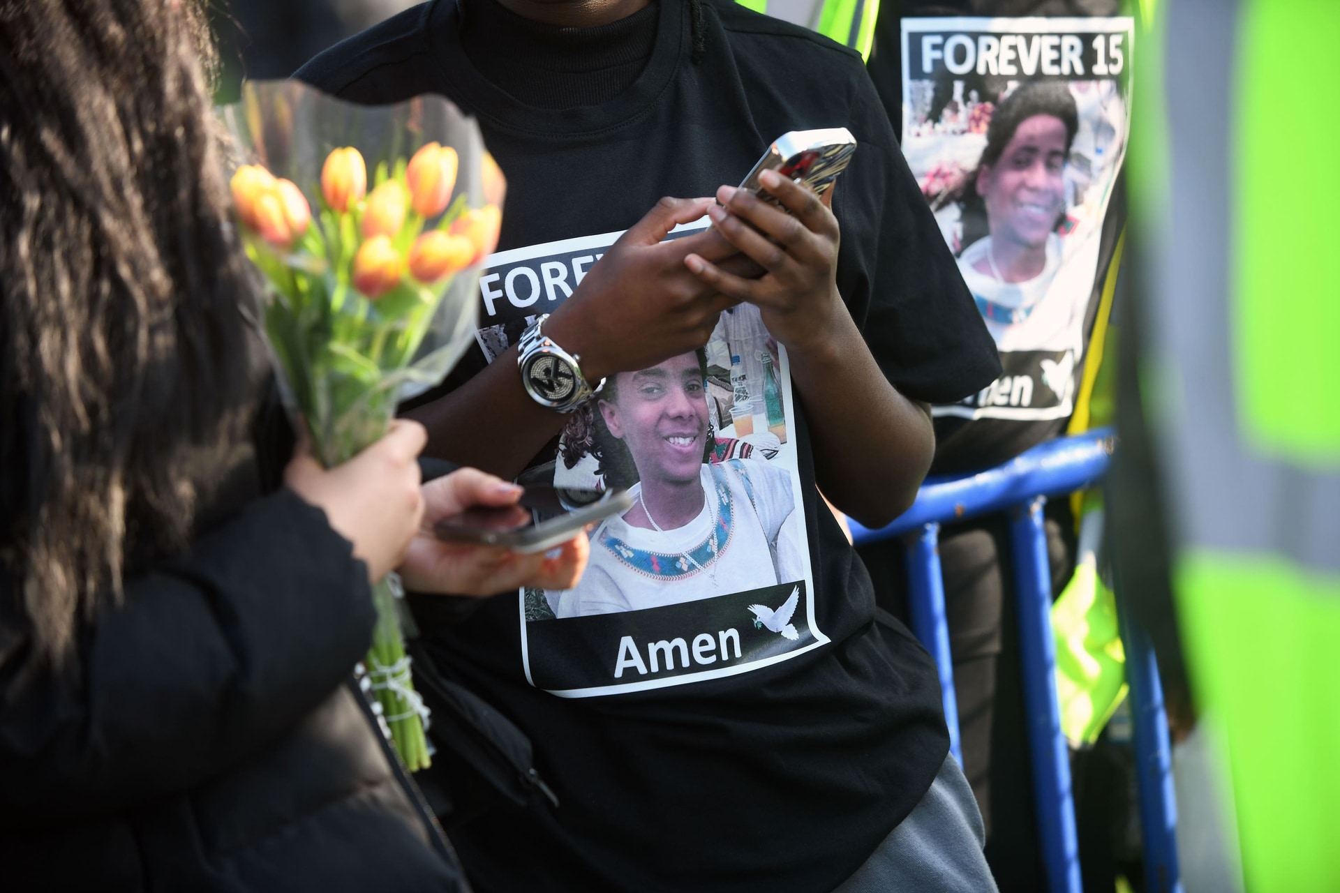 People attend a vigil for Eritrean refugee Amen Teklay, 15, who died from fatal injuries in March (Mike Boyd/PA Wire).