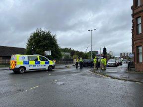 Road closed near hospital after car crashes into traffic lights