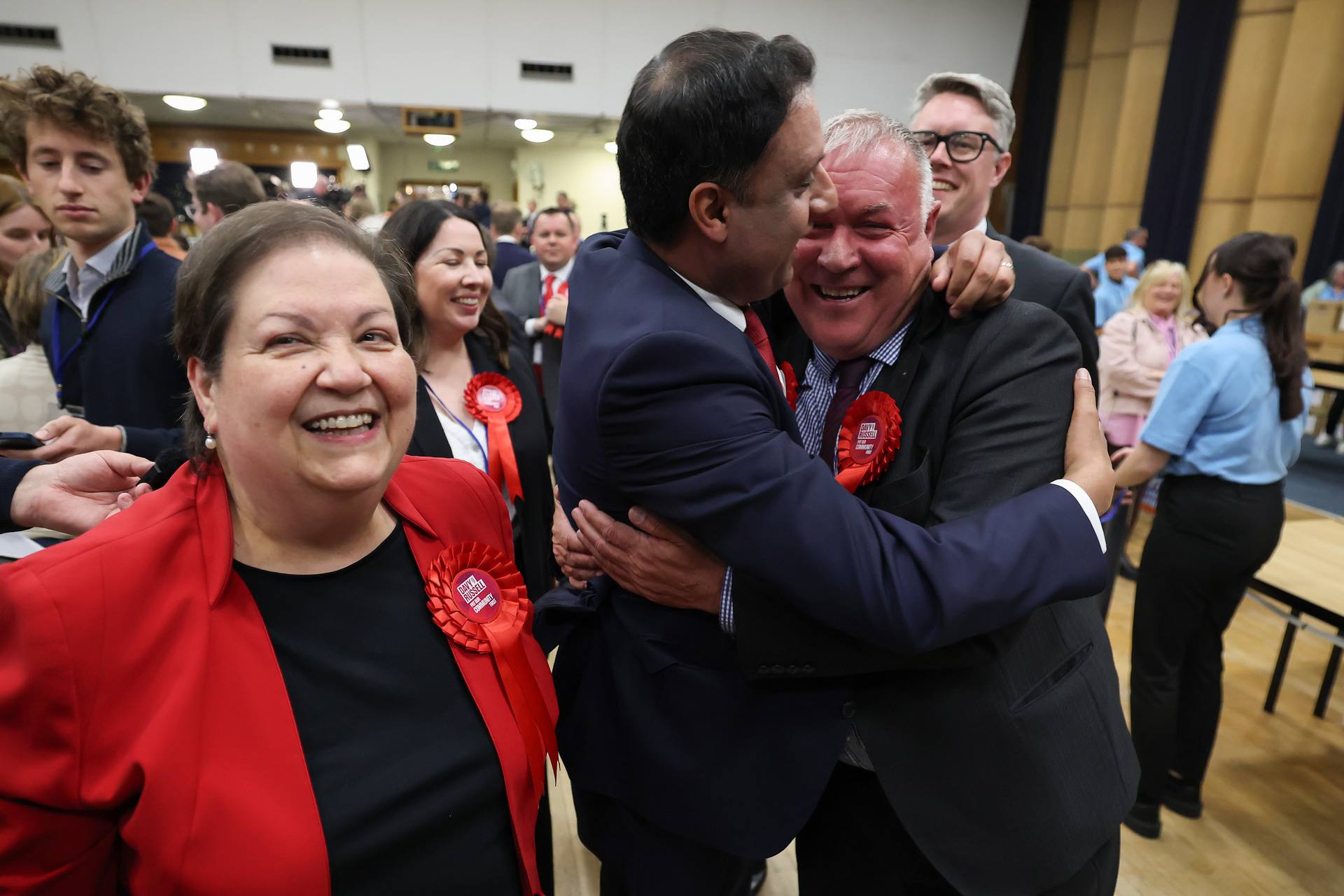 Davy Russell, Scottish Labour candidate, celebrates with Anas Sarwar and Jackie Ballie (L) after winning the Hamilton, Larkhall and Stonehouse by-election