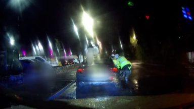 Woman who dragged two police officers along road in the Highlands jailed