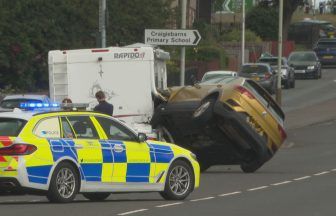 Person freed from overturned car in Dundee after crash with campervan