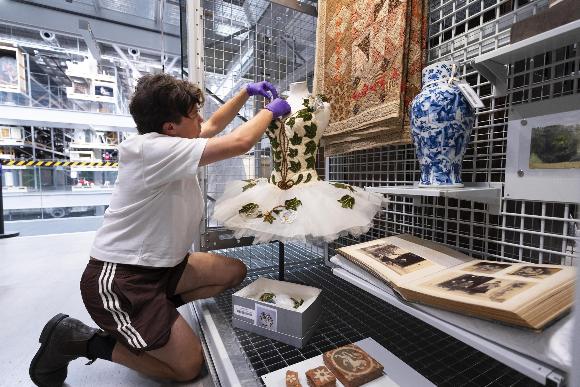 V&A East Storehouse staff preparing the new mini display ‘Makers and Creators’, curated by the Princess of Wales (David Parry/V&A East Storehouse).
