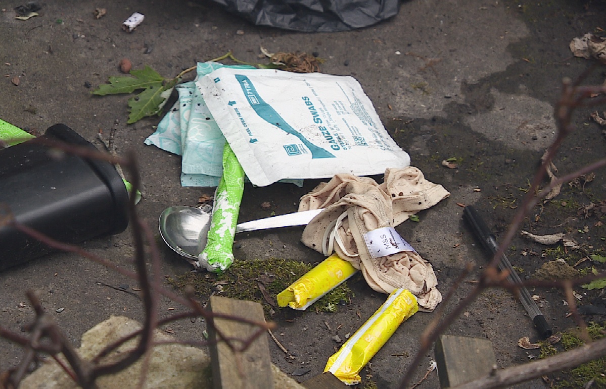 Private waste ground near the Thistle is strewn with condoms, needles, spoons, and other drug paraphernalia.