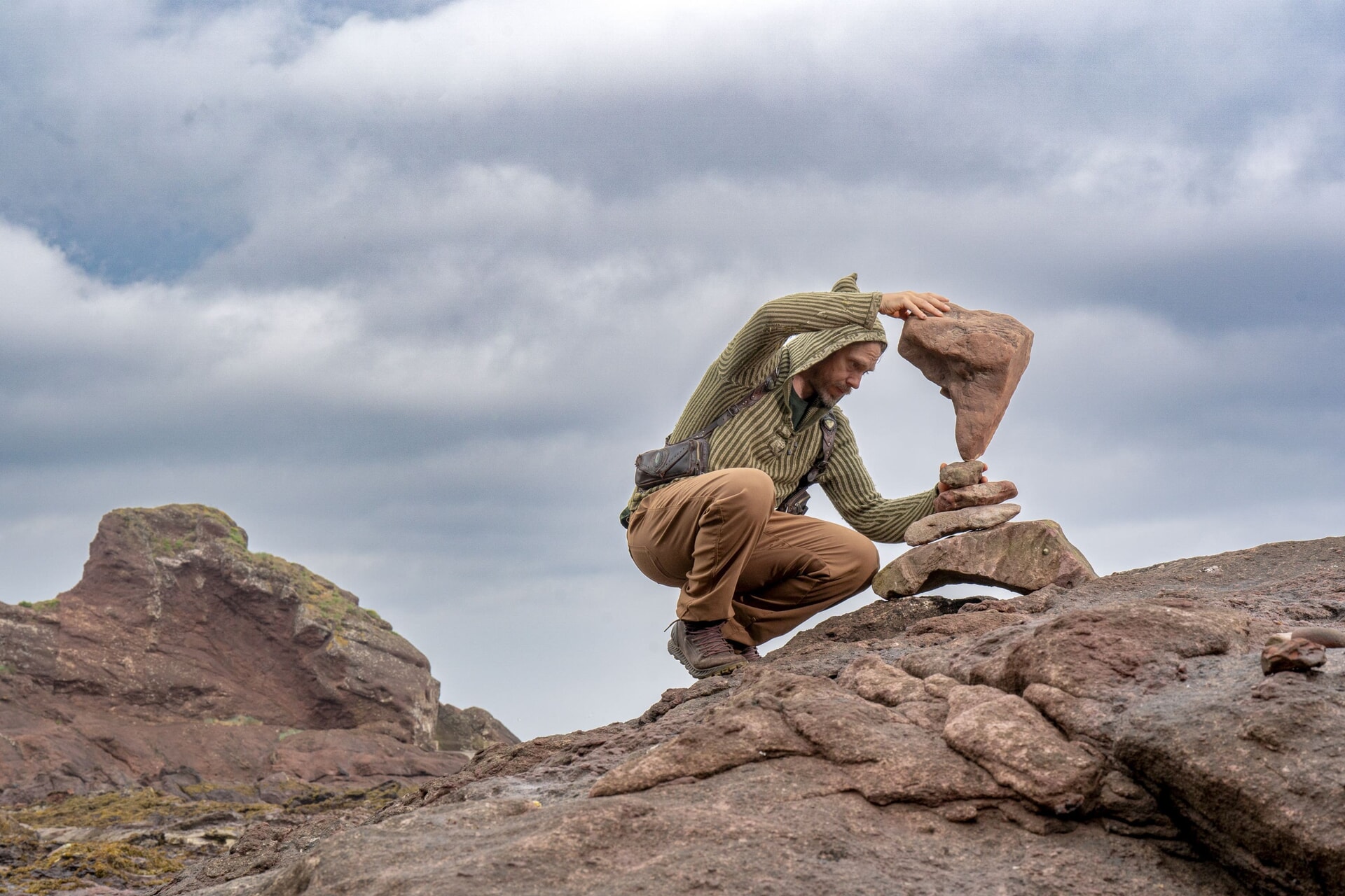 Artist Michael Grab, aka ‘Gravity Glue’, balancing rocks on Bayswell Beach in Dunbar.