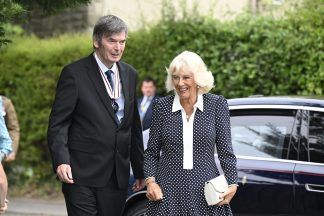 Queen Camilla laments library closures during visit to community hub