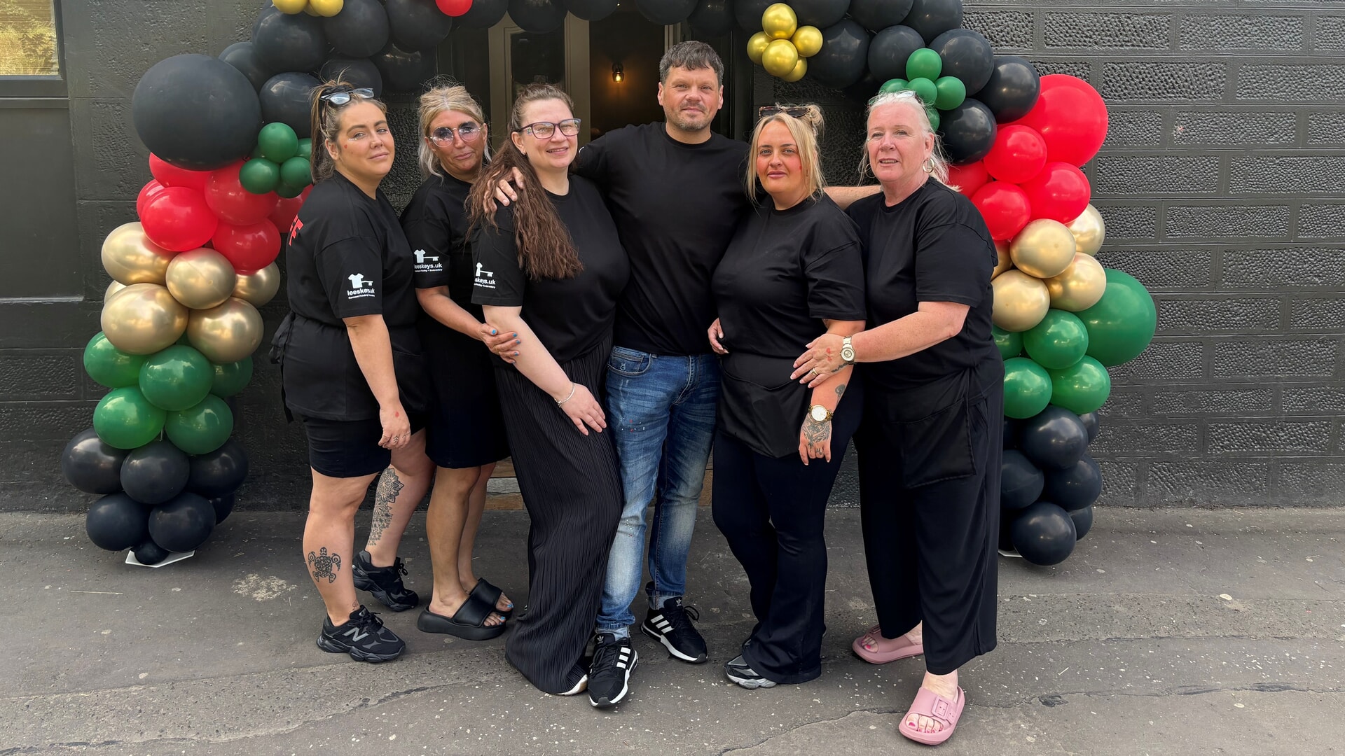 Members of a Dundee community outside Sandy's Bar in Dundee, close to where scientist Dr Fortune Gomo, 39, was fatally attacked, during a charity event to raise money for her grieving family and 'honour her name and her life'.