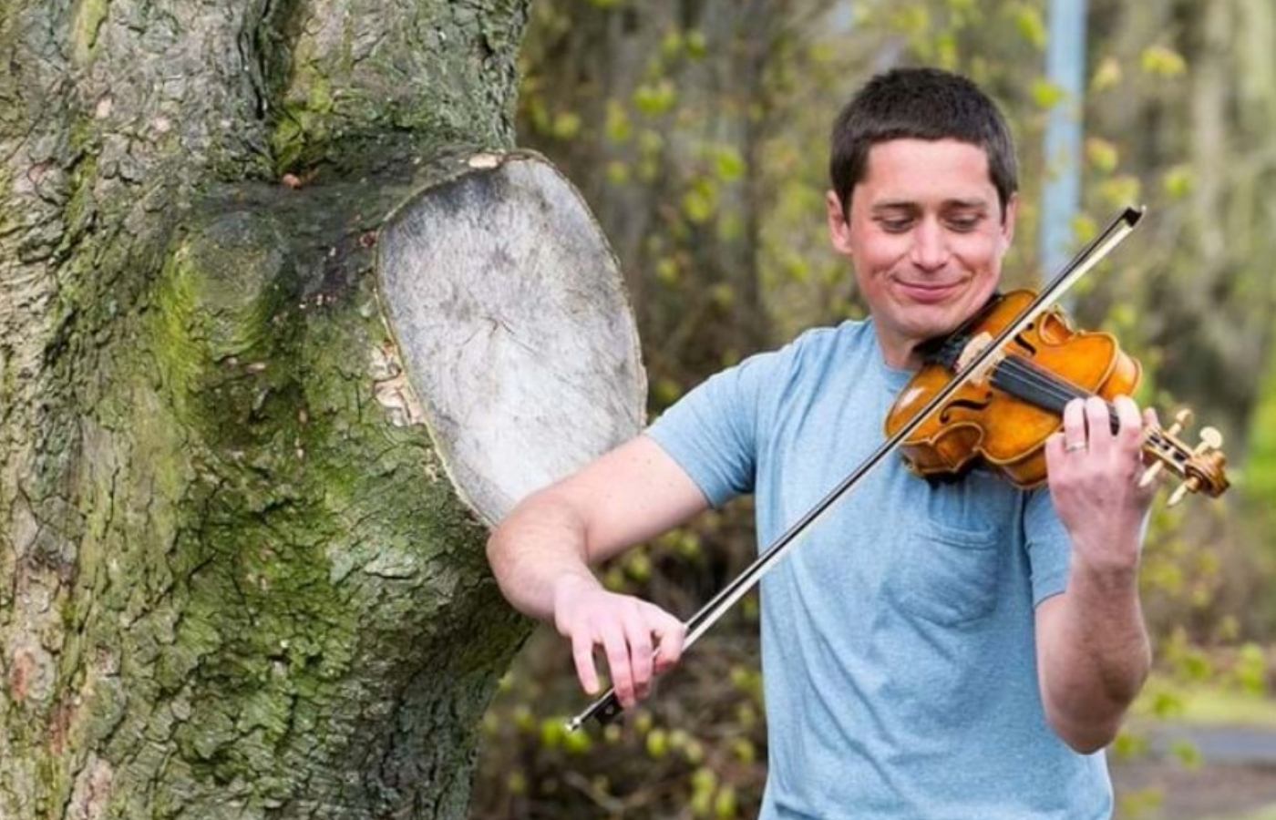 Violinist and actor Thoren Ferguson using the violin made from the Wilfred Owen Sycamore tree in Edinburgh.