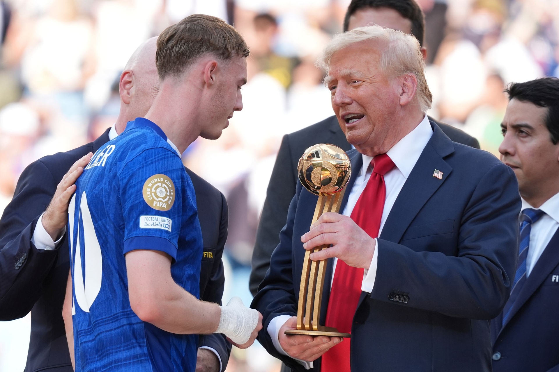 Mr Trump, right, presented the Golden Ball award for the competition’s best player to Chelsea’s Cole Palmer (Jacquelyn Martin/AP).