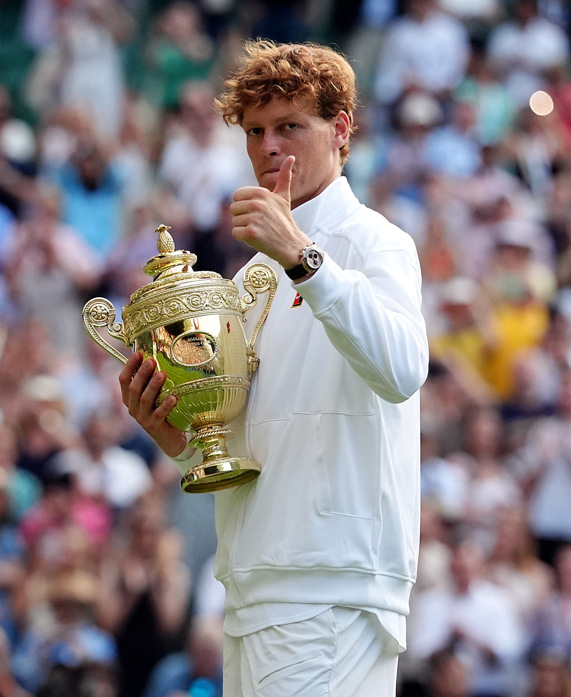 Jannik Sinner with the trophy following his victory over Carlos Alcaraz at Wimbledon (Adam Davy/PA).