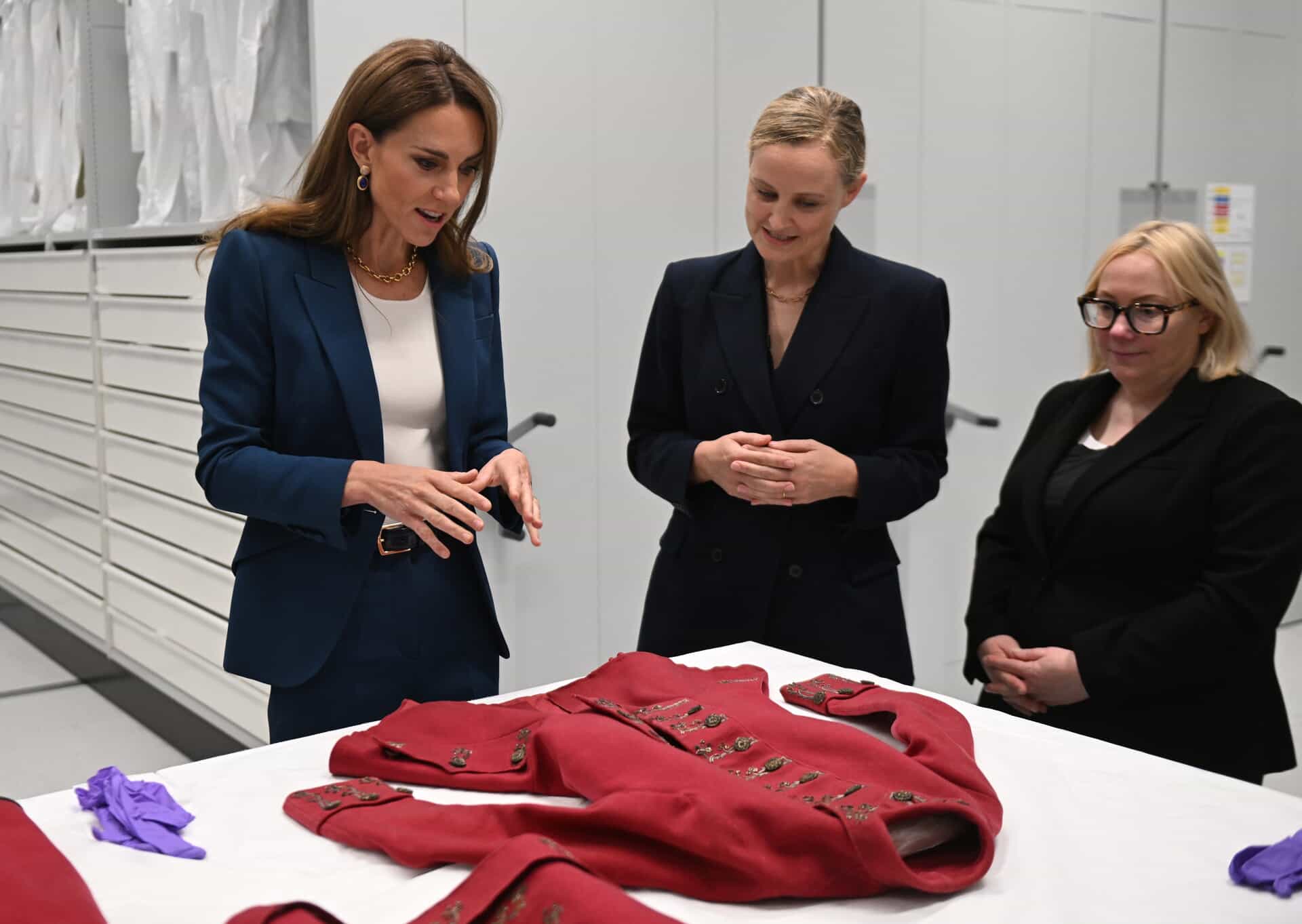 The Princess of Wales joined textiles curator Oriole Cullen and Kate Parsons, director of collections care and access (Eddie Mulholland/Daily Telegraph).