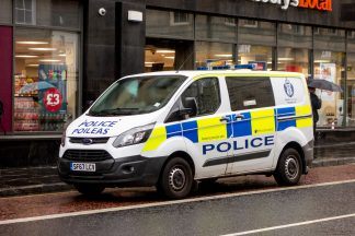 Two officers taken to hospital after van crashes in East Ayrshire