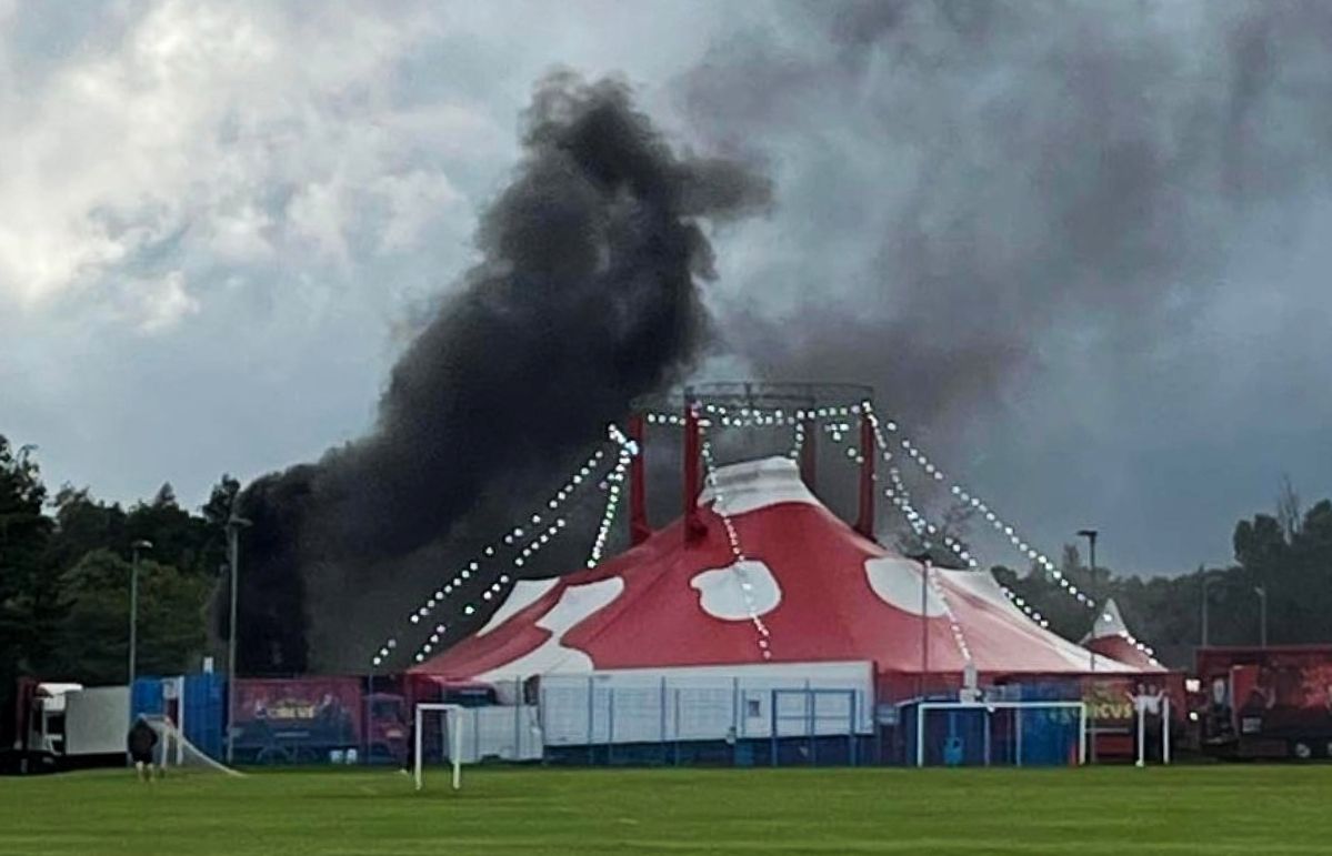 Black smoke could be seen behind a circus tent at the event, as flames engulfed a lorry on the site.