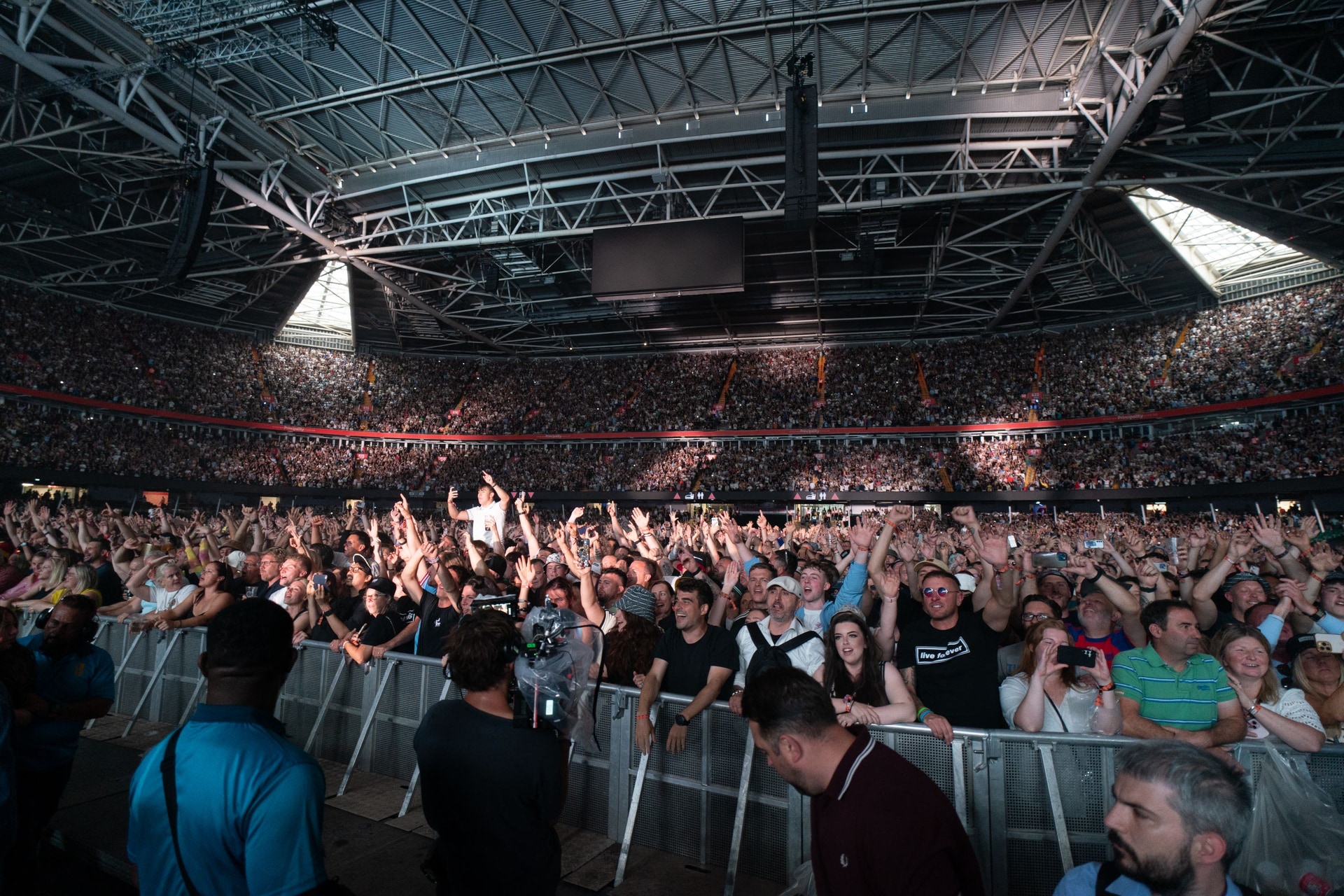 The crowd waits for Oasis to take to the stage