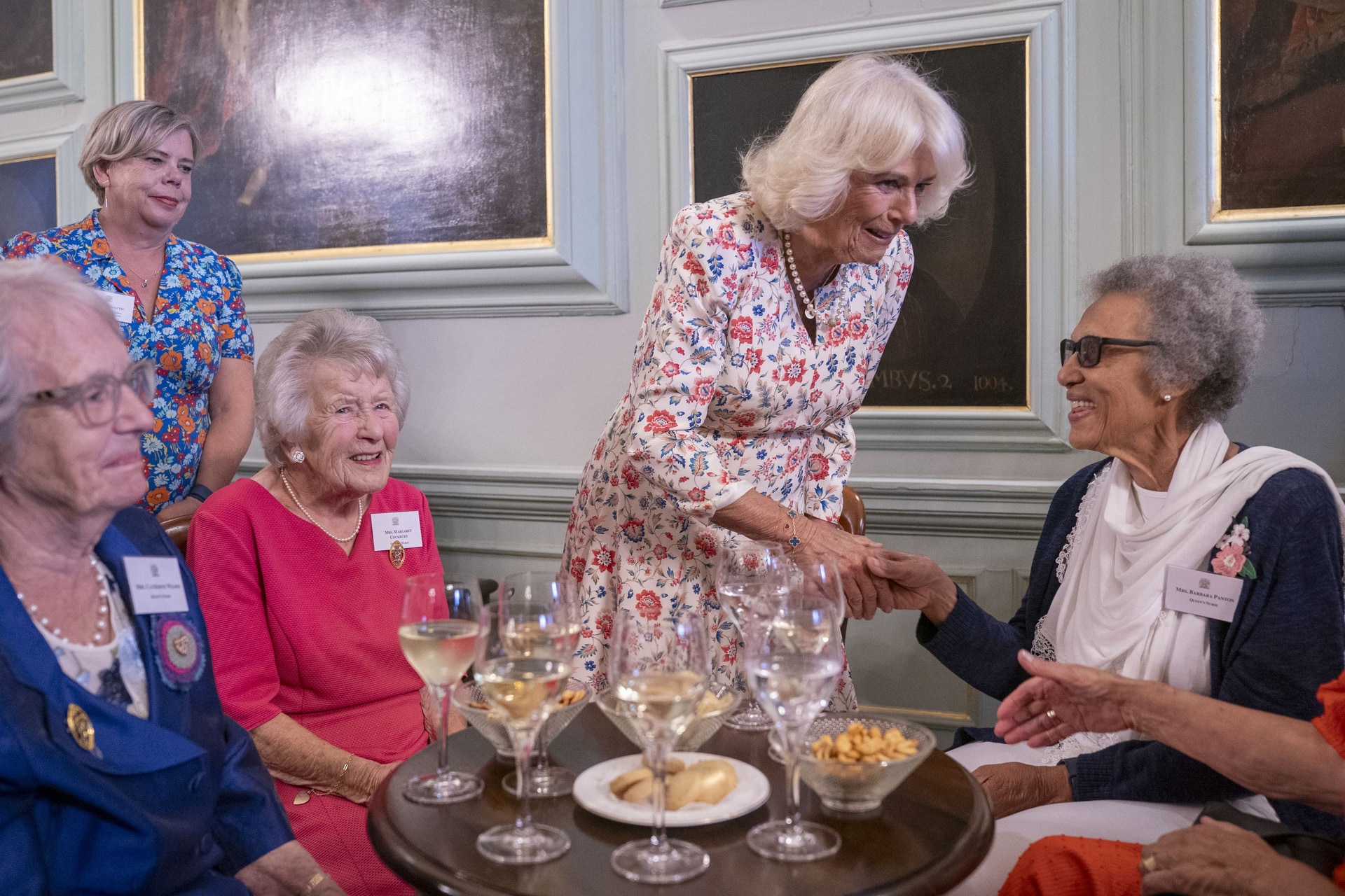 Queen Camilla spoke with Queen’s Nurse Barbara Panton (right), at a reception for former and current QNIS nurses at the Palace of Holyroodhouse in Edinburgh (Jane Barlow/PA).