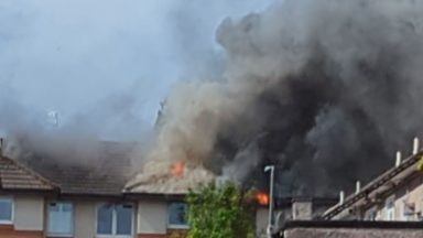 Fire engulfs three-storey building after breaking out in Newton Mearns flat block