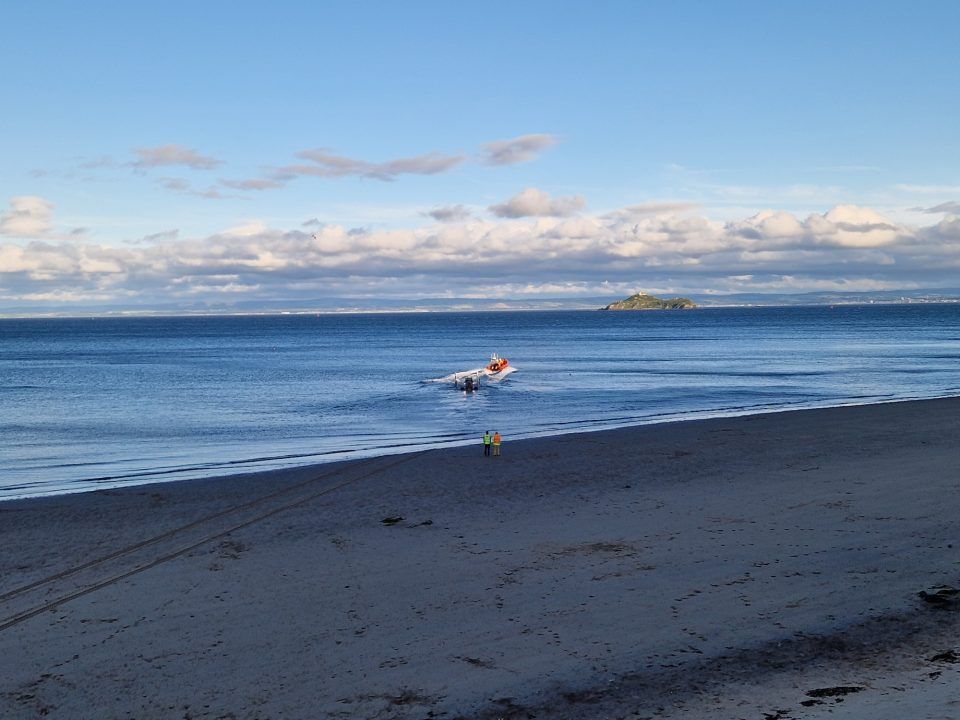 Lifeboat crews called to help capsized sailing dinghy off Portobello beach