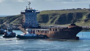 Container ship pictured leaving Aberdeen harbour five months after fatal collision
