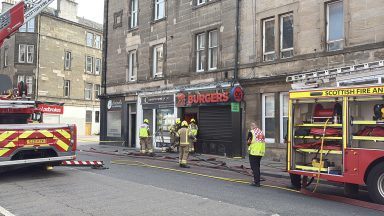 Edinburgh road shut after firefighters called to tackle blaze at business