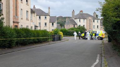 Armed police called to reports of men with firearm in Edinburgh before flat blaze discovered