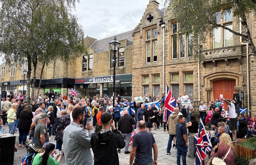 Hundreds gather for protests outside hotel housing asylum seekers in ...