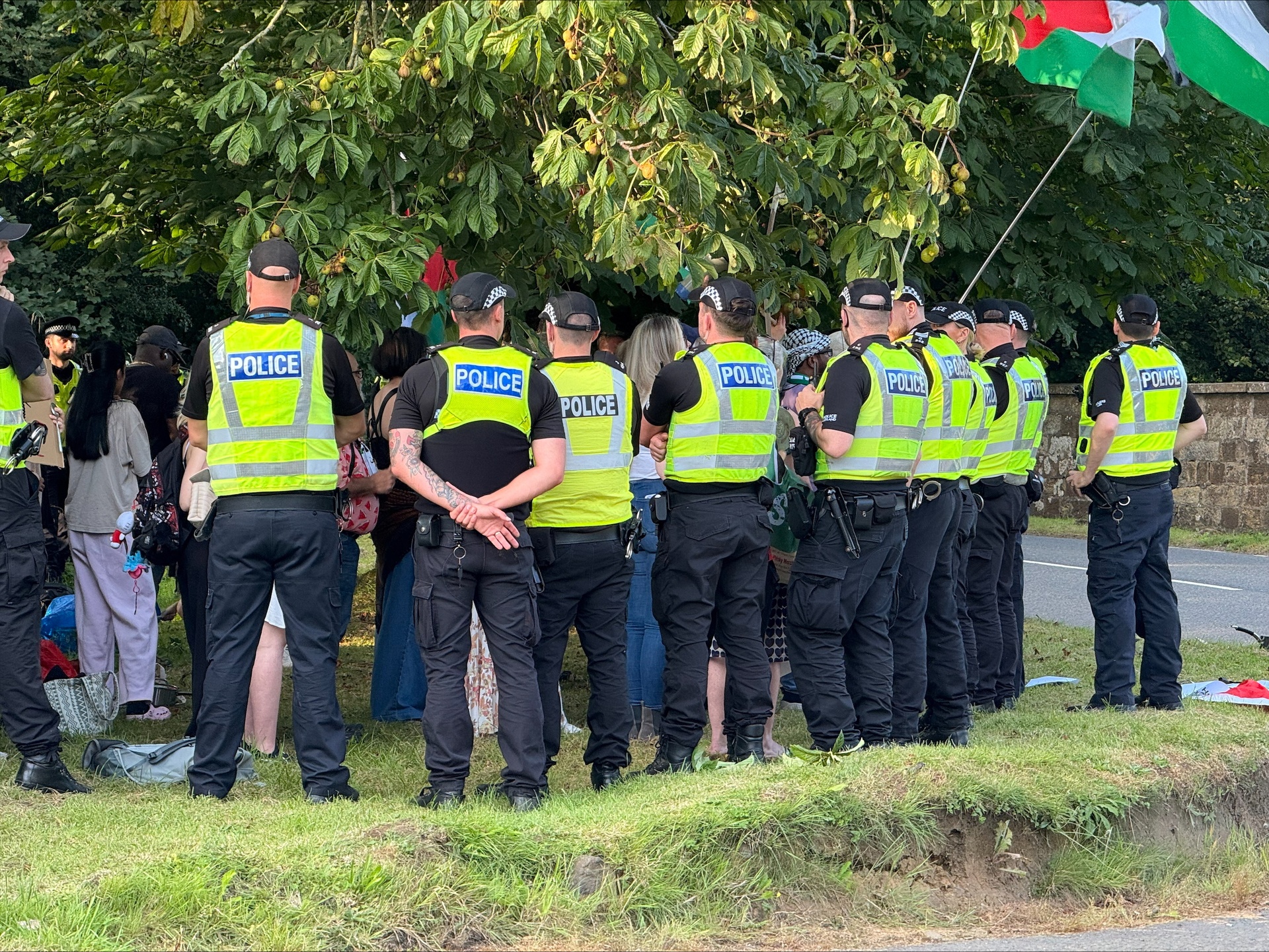 Police officers surrounded protesters (Craig Meighan/PA).