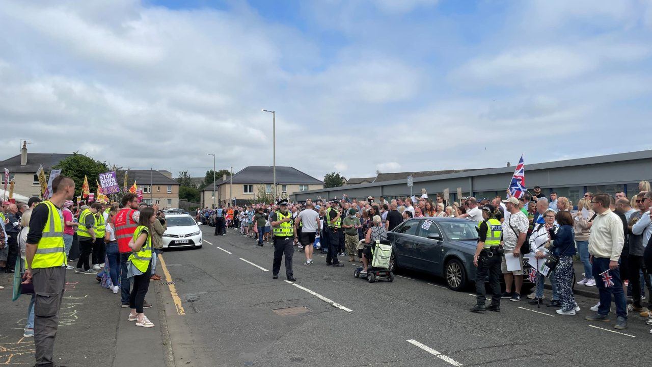 Demonstrators on opposite sides of the road at the protest.