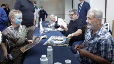 Mel Gibson poses for selfies with fans to mark 30 years of Braveheart film