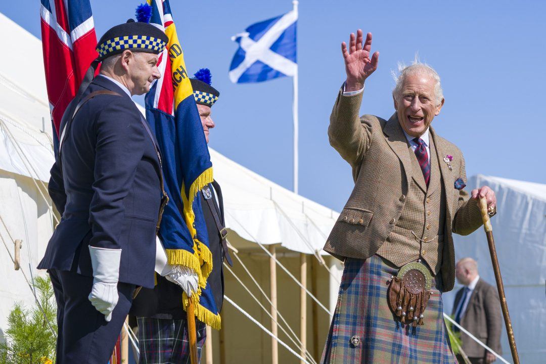 King enjoys dram of whisky at Highland Games